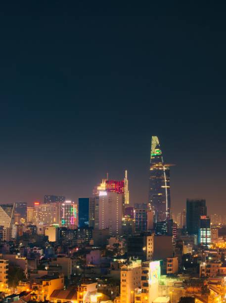 istock Skyline of Saigon (Ho Chi Minh City) at night. Vertical shot with negative space. 1198341220