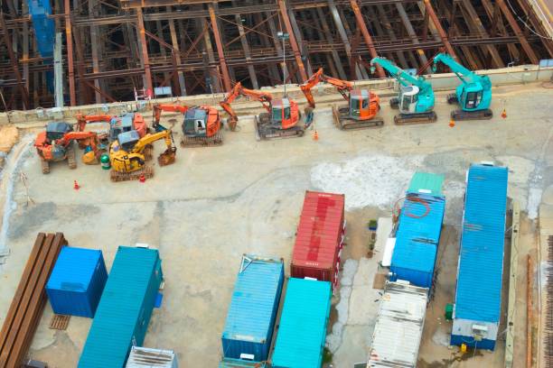 istock Heavy machinery and containers at a construction site. Very high angle view. 1198344110