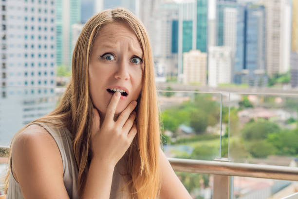 istock The girl works in a noise on the background of construction. Work in the noise concept 1198347301