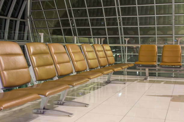 istock The empty airport terminal waiting area with chairs in night 1198348530