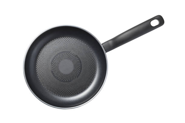 istock Black skillet with non-stick coated surface isolated 1198352475