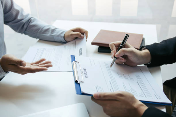 istock The interview room while the staff is preparing the resume document and presenting to the manager who is talking and analyzing about the work experience. 1198354265