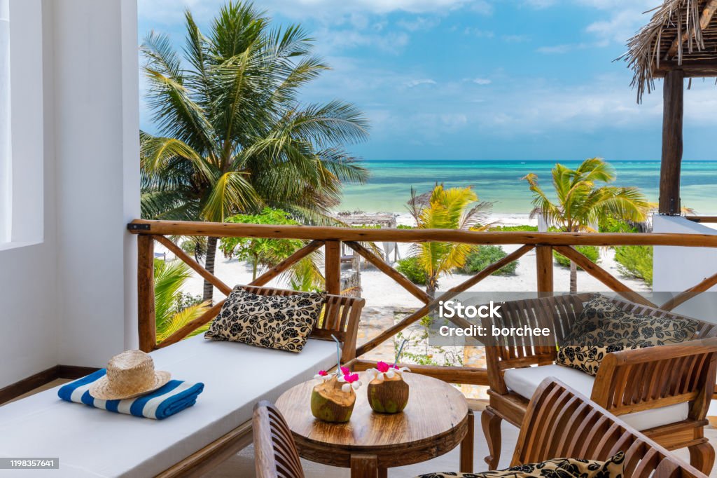 Beachfront Bungalow With Sea View Enjoying holidays in private villa near Indian ocean (Zanzibar island, Tanzania). Property released. Beach Stock Photo