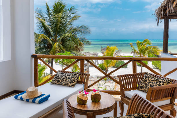 Beachfront Bungalow With Sea View Enjoying holidays in private villa near Indian ocean (Zanzibar island, Tanzania). Property released. holiday camp stock pictures, royalty-free photos & images