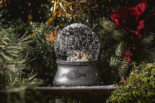 Christmas glass snowball on rustic background