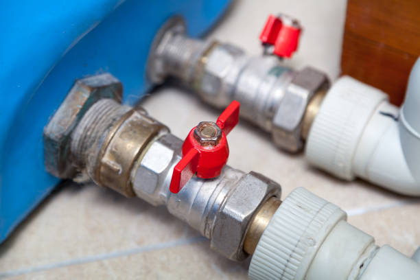 istock Two metal taps on water pipeline close-up 1198359818