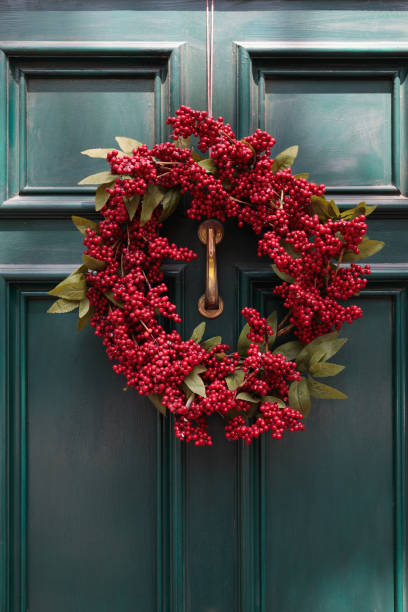 istock Christmas wreath on a green door 1198360551