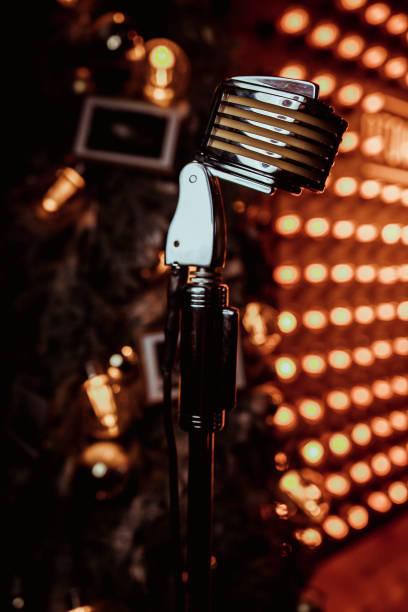 istock vintage microphone with color background in nightclub 1198361107