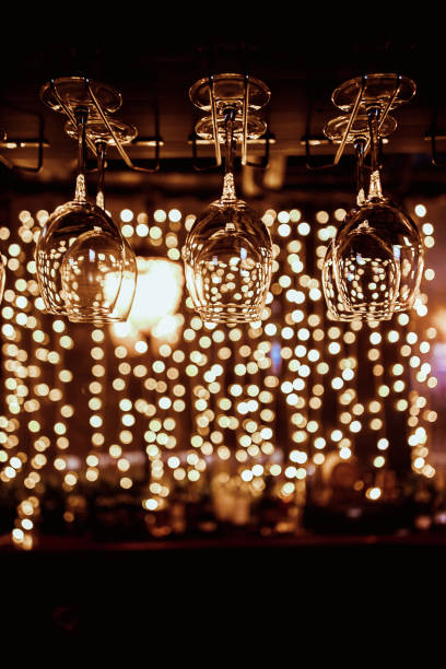 istock Empty glasses for wine above a bar rack 1198361185