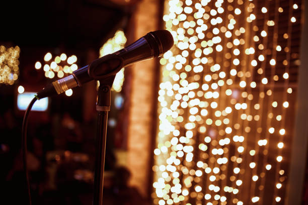 istock vintage microphone with color background in nightclub 1198361265