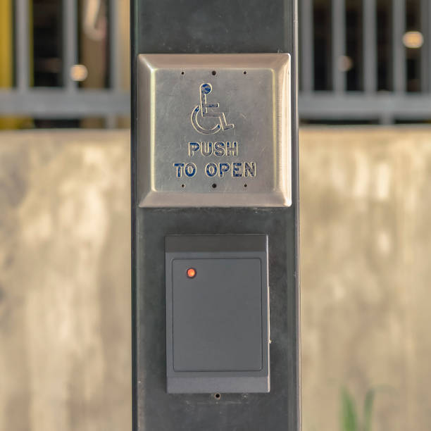 istock Square frame Selective focus on a handicap push button at the entrance of a building 1198361388