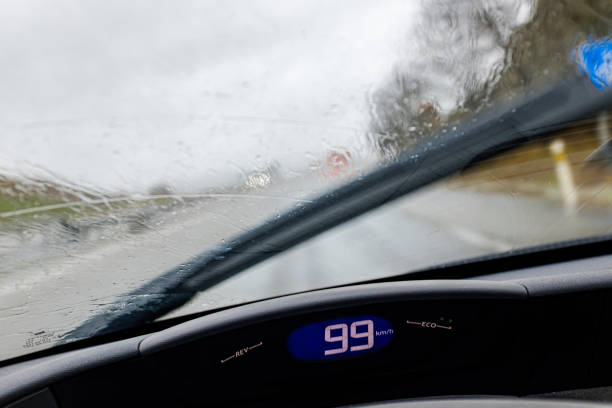 istock Driving on a road on a rainy weather road from driver visibility scene 1198363778