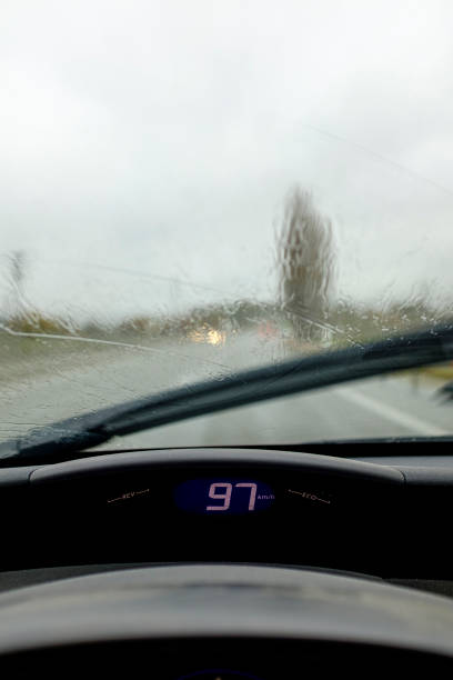 istock Driving on a road on a rainy weather road from driver visibility scene 1198363792