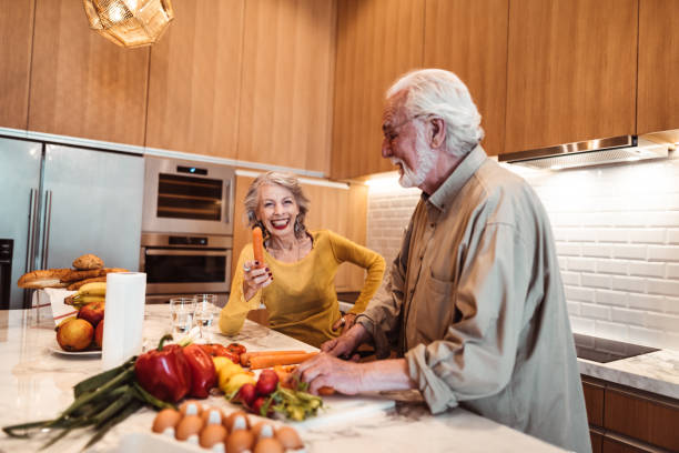 istock senior couple cooking in the kitchen 1198367059