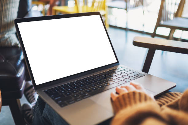 istock a woman using and touching on laptop touchpad with blank white desktop screen 1198367100