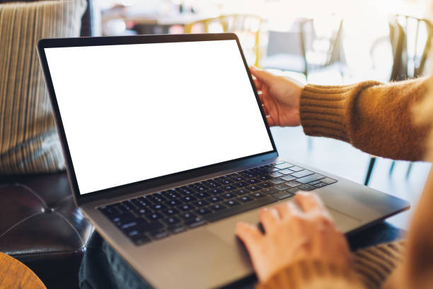 istock a woman using and touching on laptop touchpad with blank white desktop screen 1198367124
