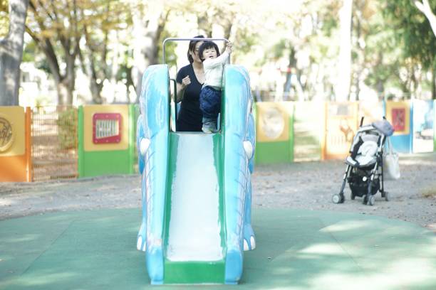 istock Baby boy playing in the park 1198370887