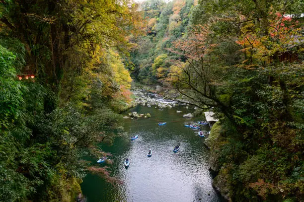 Photo of Travelers on a rowing boat at Takachiho Gorge in Kyushu, Japan