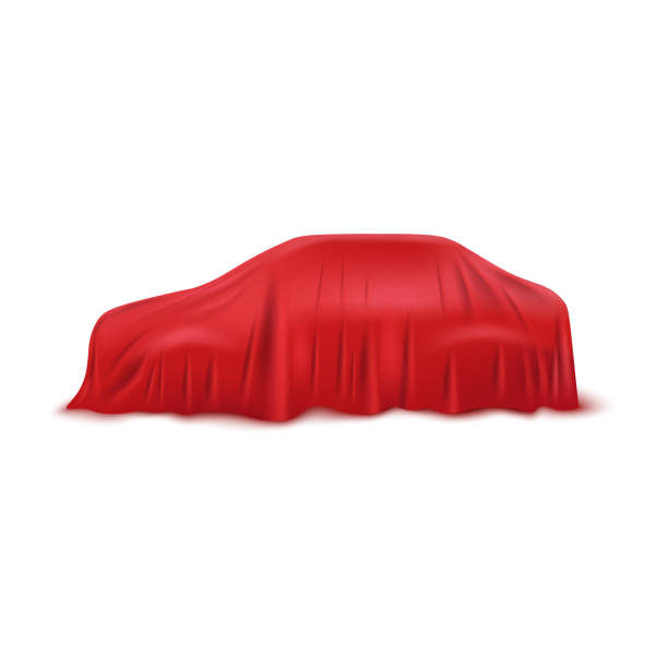 istock Realistic red car covered with a fabric cover for curtains made of silk or satin. 1198371177