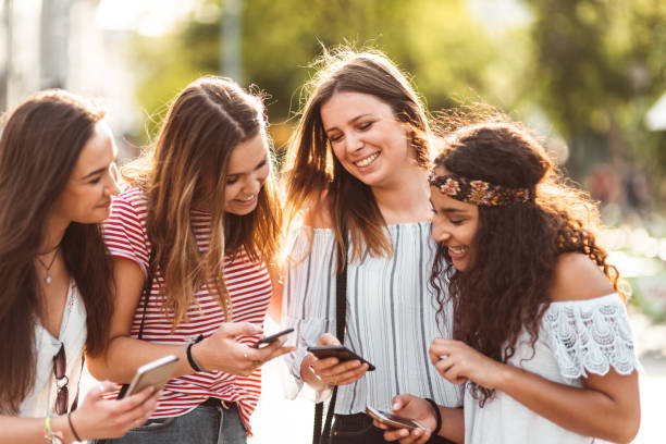 istock teens using the smartphone in the city 1198375353