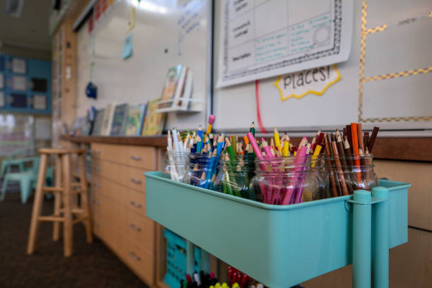 istock Movable art cart filled with various colored pencils in elementary school classroom 1198375553