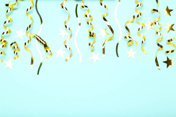 istock Golden ribbons with stars on blue background 1198375736