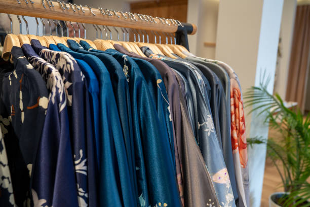 istock Various designer kimonos garments hanging on rack in store 1198375757