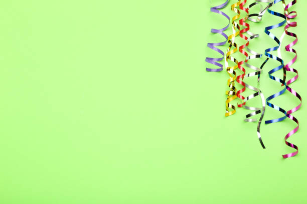 istock Colorful ribbons on green background 1198375817