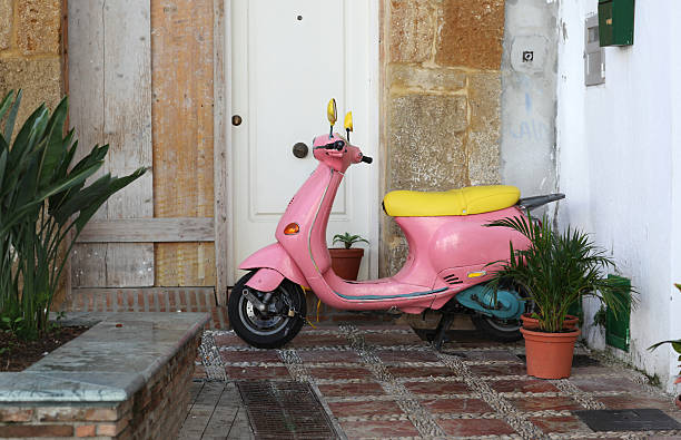 istock Parked Pink Motor Scooters in Spain 119837617