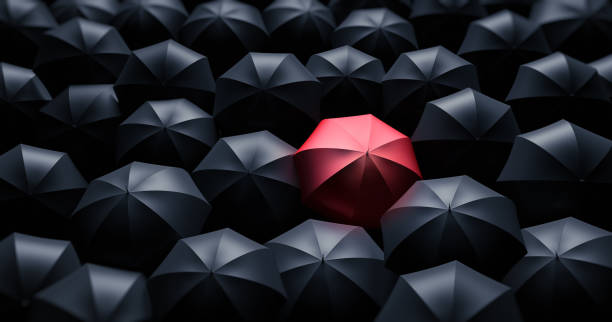 istock Crowd of Umbrellas with Leader 1198376819