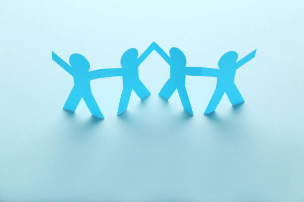 istock Paper chain people on blue background 1198376852
