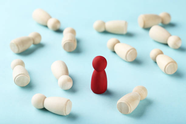 istock Leader concept. Wooden figures on blue background 1198378470