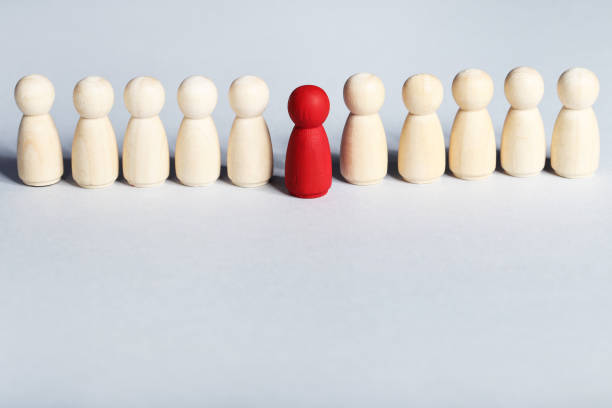 istock Leader concept. Wooden figures on gray background 1198378588