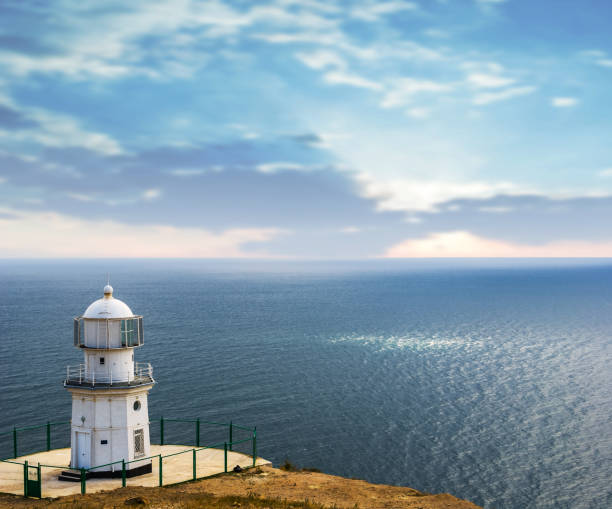 istock lighthouse on a marine cape at the early morning 1198379685