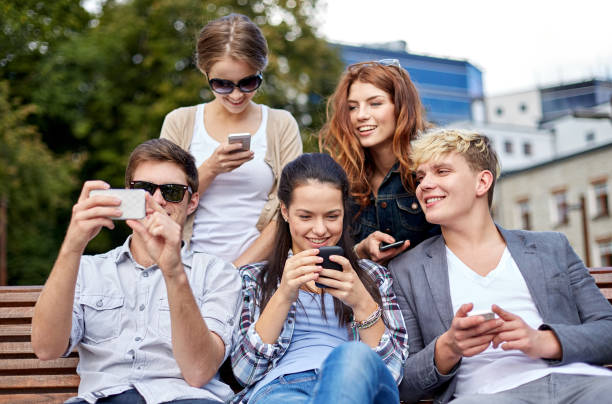 istock students or teenagers with smartphones at campus 1198380652