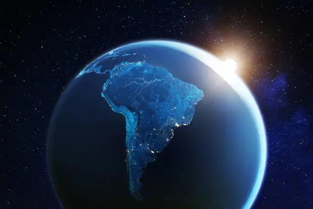 Photo of South America viewed from space with sunrise on planet Earth and stars, overview of Amazon river and forest, night lights from cities in Brazil, Argentina, Chile, Peru, map elements from NASA, 8k