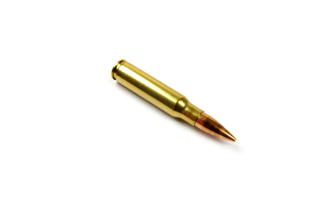 istock one single riffle bullet on a white background 1198383940