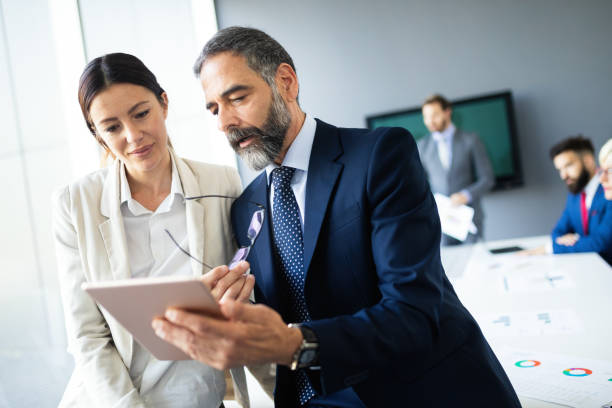 istock Business people working discussing as a team at the office 1198386480