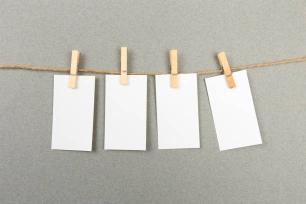 istock collection of various notes and a clothes pegs on grey background with clipping path 1198392532