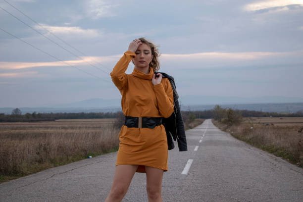 istock Young blond girl posing on the road 1198396172