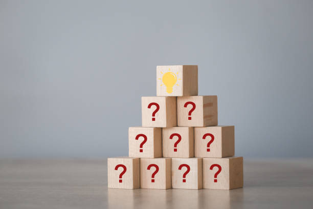 istock Arranging wood block stacking with icon question mark and lamp,thinking with question mark concept. 1198397049