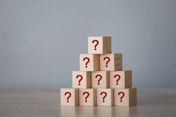 istock Arranging wood block stacking with icon question mark,thinking with question mark concept. 1198397062