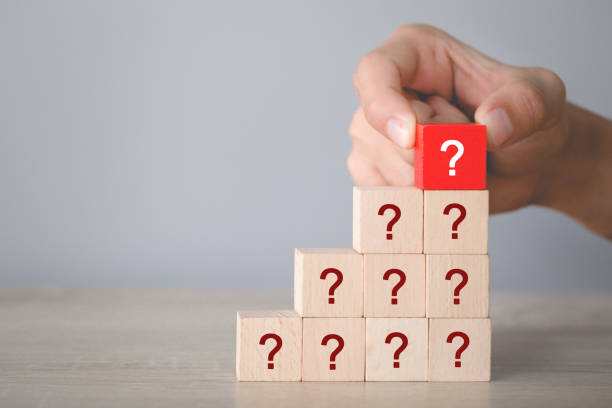 istock Hand arranging wood block stacking with icon question mark,thinking with question mark concept. 1198397240
