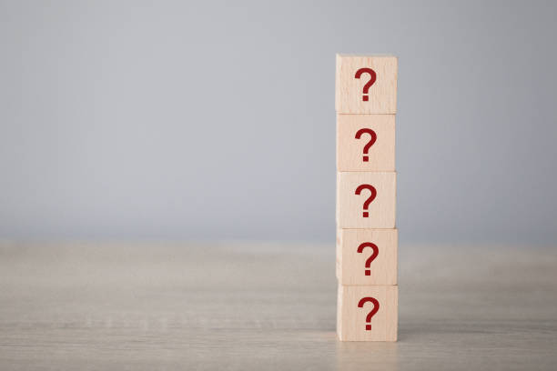 istock Arranging wood block stacking with icon question mark,thinking with question mark concept. 1198397365