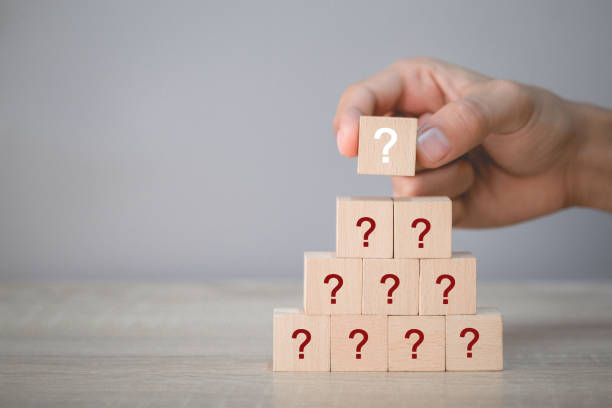 istock Hand arranging wood block stacking with icon question mark,thinking with question mark concept. 1198398426