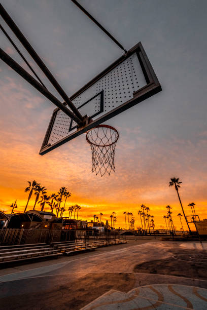 Basketball court at Venice beach, Los Angeles, California, captured during dusk Basketball court at Venice beach, Los Angeles, California, at golden hour. golden hour photos stock pictures, royalty-free photos & images