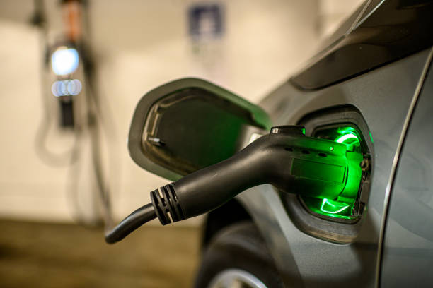 istock EV plugged into a wall outlet indoors 1198398483