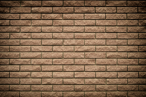 background image of brown brick wall. with black seams