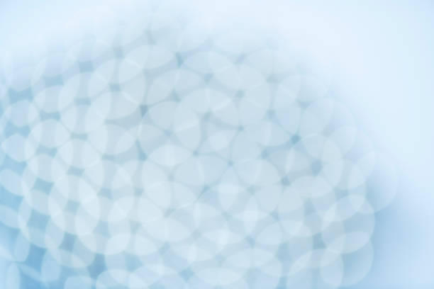 Defocused high resolution photograph of light reflections at a group of chrome spheres.