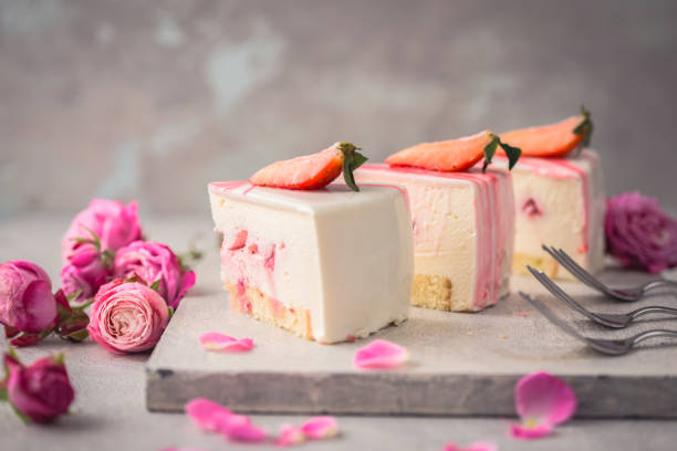 istock Strawberry mousse cake, cheesecake with fresh strawberries on light  background. Tasty strawberry mousse cake with biscuit layers and strawberries. mousse layer. 1198401311